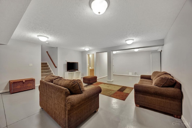 8020 Stoney Ridge Dr, Colerain Twp, OH 45247 - living area featuring finished concrete floors, a textured ceiling, and stairway