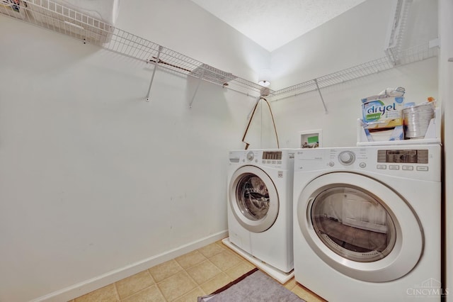 8020 Stoney Ridge Dr, Colerain Twp, OH 45247 - laundry area featuring washing machine and clothes dryer and baseboards