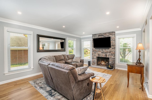 2201 Candlemaker Dr, Anderson Twp, OH 45244 - living room with light wood-type flooring, a stone fireplace, ornamental molding, and recessed lighting
