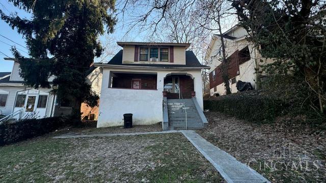 17 Clinton Springs Ln, Cincinnati, OH 45217 - bungalow featuring stairway, a porch, and stucco siding