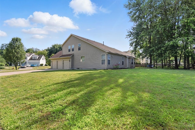 1287 Mcguffey Ln, Union Twp, OH 45103 - view of side of home with concrete driveway, a yard, and an attached garage