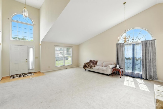 1287 Mcguffey Ln, Union Twp, OH 45103 - entryway with high vaulted ceiling, carpet flooring, and a chandelier