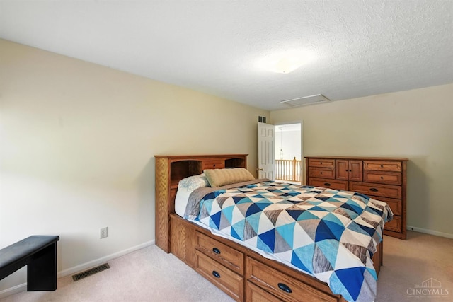 1287 Mcguffey Ln, Union Twp, OH 45103 - bedroom featuring light carpet, attic access, and a textured ceiling