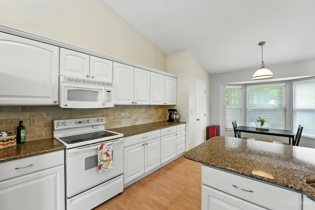 1287 Mcguffey Ln, Union Twp, OH 45103 - kitchen featuring white appliances, lofted ceiling, backsplash, white cabinetry, and dark stone counters