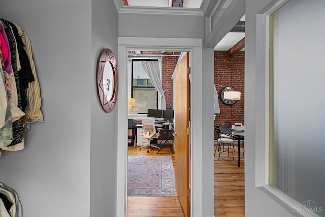 26 E Sixth St Unit 403, Cincinnati, OH 45202 - hall with an office area, wood finished floors, brick wall, and crown molding