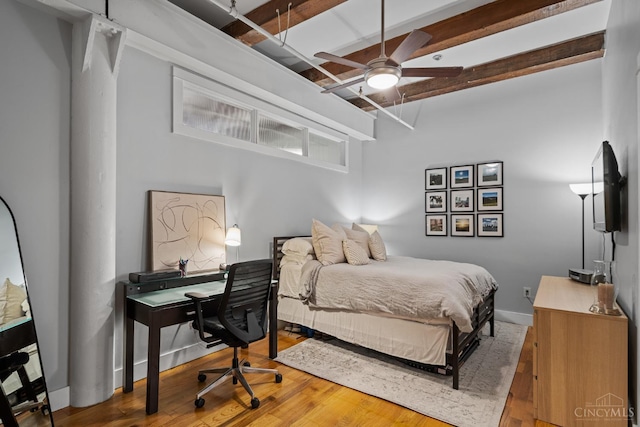 26 E Sixth St Unit 403, Cincinnati, OH 45202 - bedroom with a desk, wood finished floors, beamed ceiling, and ceiling fan