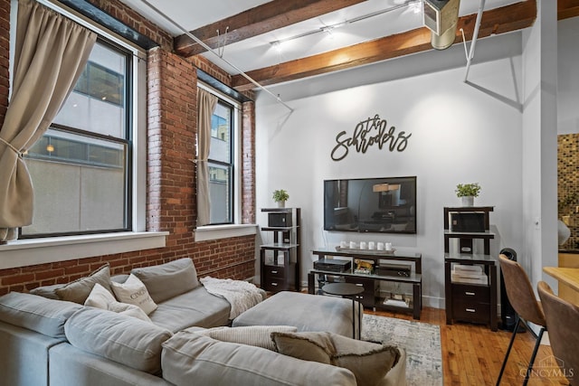 26 E Sixth St Unit 403, Cincinnati, OH 45202 - living room with brick wall, wood-type flooring, beam ceiling, and a high ceiling