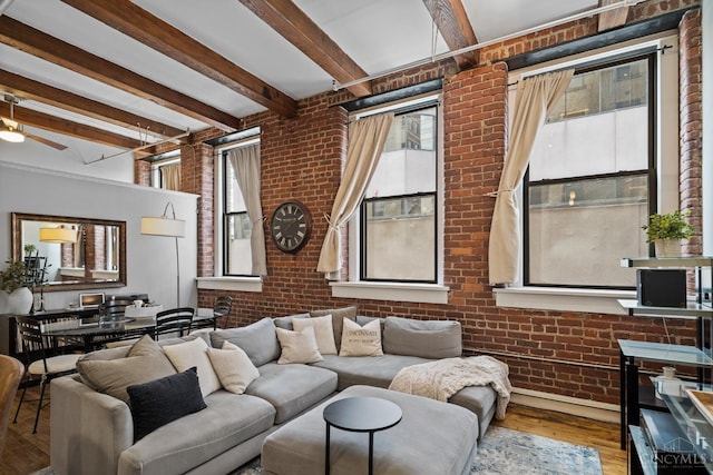 26 E Sixth St Unit 403, Cincinnati, OH 45202 - living area with brick wall, healthy amount of natural light, beam ceiling, hardwood / wood-style floors, and a ceiling fan