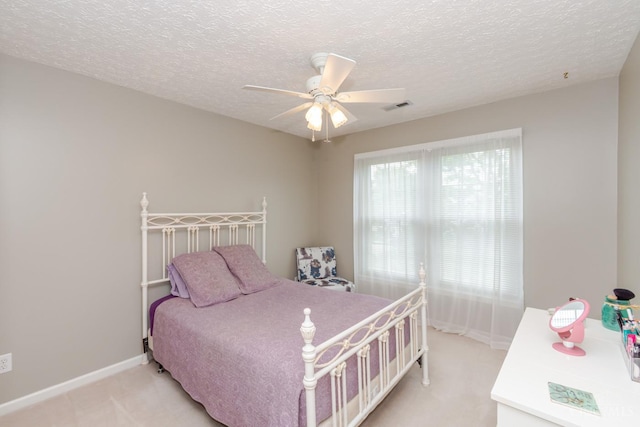 2220 Sulky Ct, Beavercreek Twp, OH 45434 - bedroom with light colored carpet, a textured ceiling, and a ceiling fan