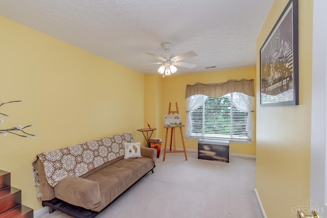 2220 Sulky Ct, Beavercreek Twp, OH 45434 - living room featuring carpet, ceiling fan, and a textured ceiling