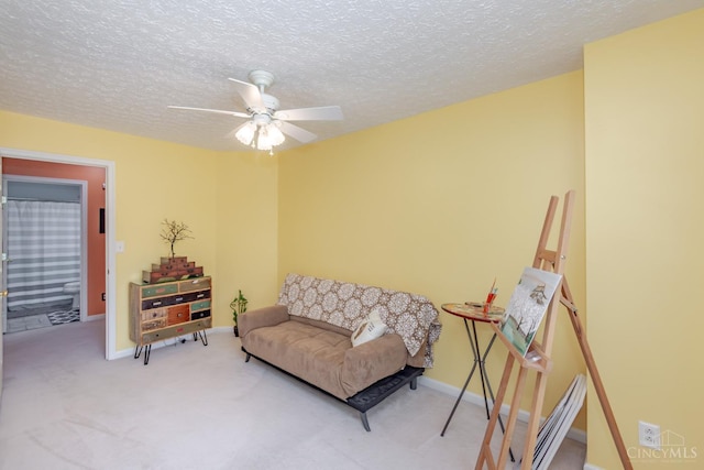 2220 Sulky Ct, Beavercreek Twp, OH 45434 - living area featuring a ceiling fan, carpet, and a textured ceiling