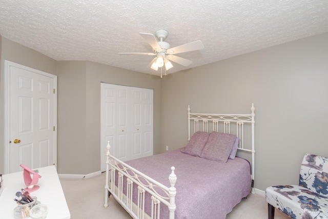 2220 Sulky Ct, Beavercreek Twp, OH 45434 - bedroom with light carpet, a closet, ceiling fan, and a textured ceiling