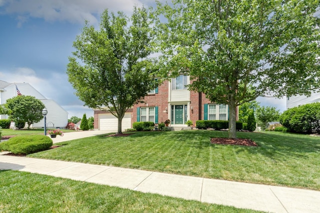2220 Sulky Ct, Beavercreek Twp, OH 45434 - view of front of home with brick siding, driveway, and a front lawn