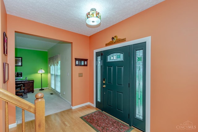 2220 Sulky Ct, Beavercreek Twp, OH 45434 - foyer entrance with wood finished floors and a textured ceiling