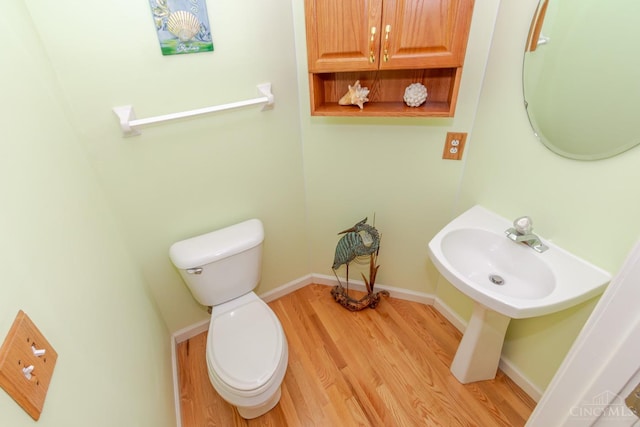 2220 Sulky Ct, Beavercreek Twp, OH 45434 - half bathroom featuring toilet and wood finished floors