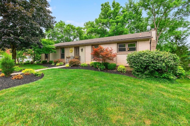 5613 Williamsburg Way, Fairfield, OH 45014 - ranch-style house with brick siding, a chimney, and a front lawn