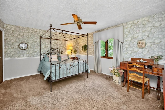 5613 Williamsburg Way, Fairfield, OH 45014 - carpeted bedroom with wallpapered walls, a textured ceiling, and a ceiling fan