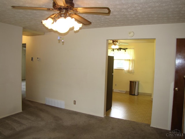 2573 Adams Rd, Colerain Twp, OH 45231 - unfurnished room with ceiling fan, a smoke detector, a textured ceiling, and carpet floors