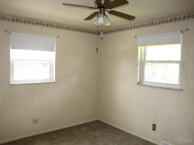 2573 Adams Rd, Colerain Twp, OH 45231 - empty room with dark colored carpet and ceiling fan