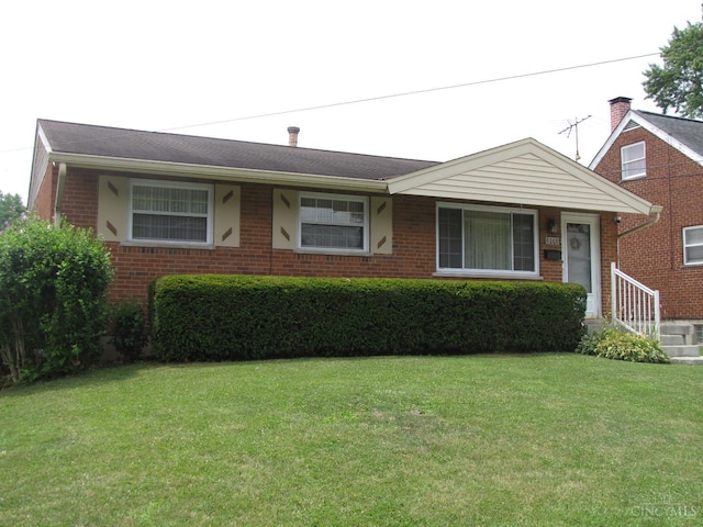 2573 Adams Rd, Colerain Twp, OH 45231 - view of front of house with brick siding and a front lawn