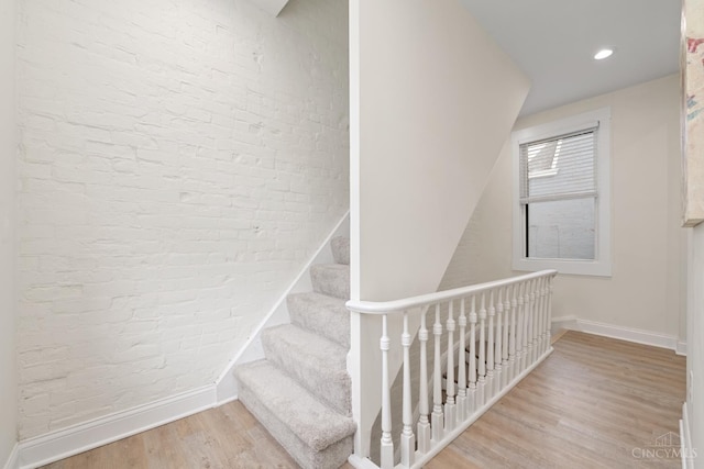 4249 Chambers St, Cincinnati, OH 45223 - stairs featuring wood finished floors and brick wall