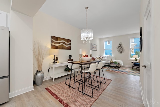 4249 Chambers St, Cincinnati, OH 45223 - dining room featuring wood finished floors and a chandelier