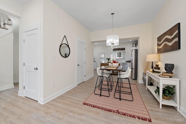 4249 Chambers St, Cincinnati, OH 45223 - dining room with light wood finished floors and a chandelier