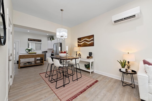 4249 Chambers St, Cincinnati, OH 45223 - dining space featuring a wall mounted AC, light wood-style floors, a chandelier, and recessed lighting