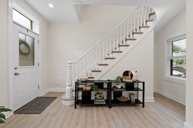 4249 Chambers St, Cincinnati, OH 45223 - entryway with plenty of natural light, stairs, wood finished floors, brick wall, and recessed lighting