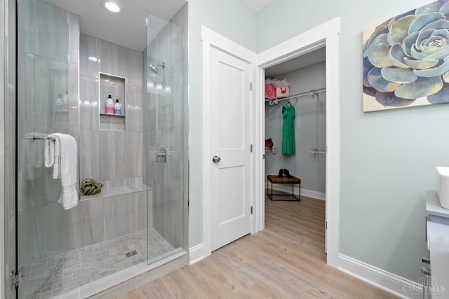 4249 Chambers St, Cincinnati, OH 45223 - full bathroom featuring a shower stall, a spacious closet, wood finished floors, recessed lighting, and vanity