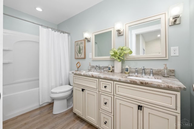 4249 Chambers St, Cincinnati, OH 45223 - full bathroom featuring double vanity, wood finished floors, and shower / bathtub combination with curtain