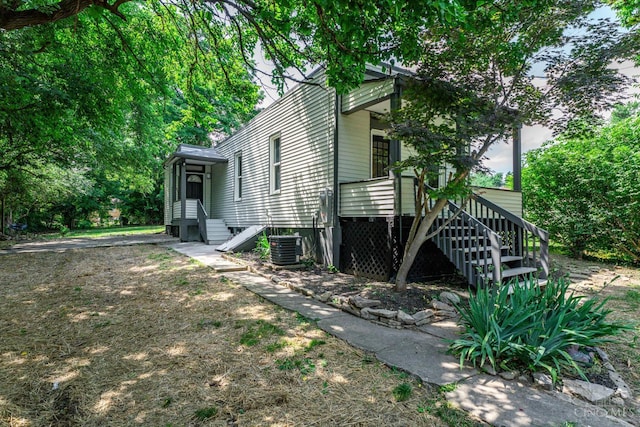 3997 Washington Ave, Cheviot, OH 45211 - view of side of home featuring stairs and a wooden deck
