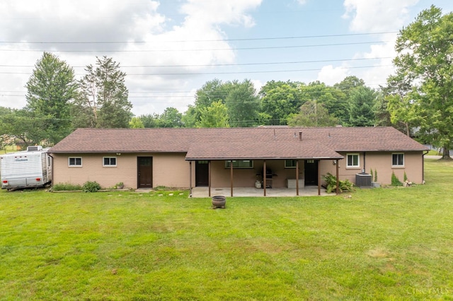 3918 Michael Dr, Union Twp, OH 45255 - rear view of house featuring a patio, a yard, and a shingled roof