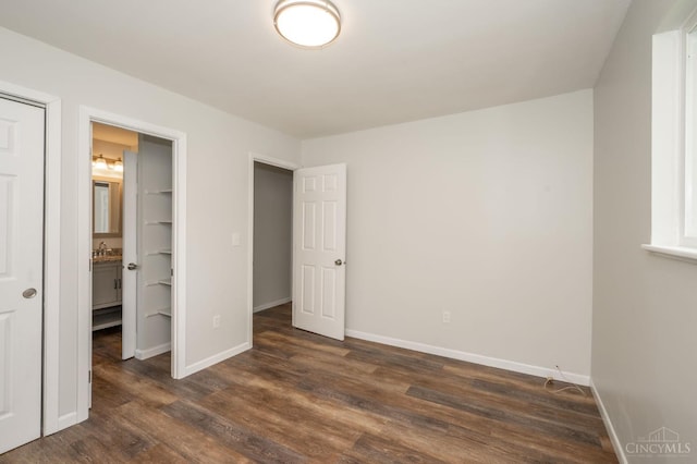 3918 Michael Dr, Union Twp, OH 45255 - unfurnished bedroom with dark wood finished floors and a sink