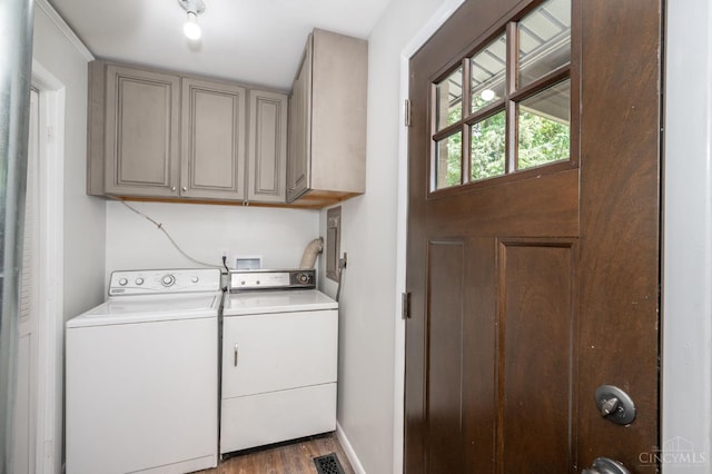 3918 Michael Dr, Union Twp, OH 45255 - laundry room featuring washer and dryer, cabinet space, and wood finished floors