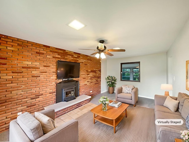 3198 Sunnyhollow Ln, Green Twp, OH 45239 - carpeted living room featuring a ceiling fan, brick wall, and a wood stove