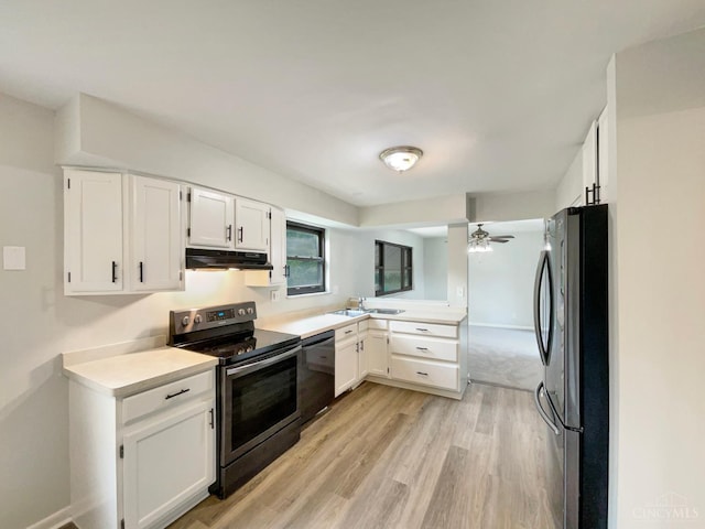 3198 Sunnyhollow Ln, Green Twp, OH 45239 - kitchen featuring stainless steel appliances, under cabinet range hood, light wood-style floors, ceiling fan, and white cabinets