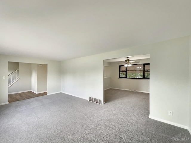 3198 Sunnyhollow Ln, Green Twp, OH 45239 - spare room featuring dark carpet, a ceiling fan, and stairway