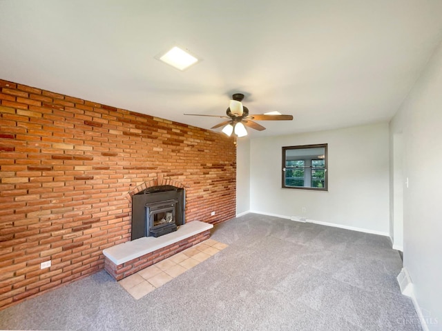 3198 Sunnyhollow Ln, Green Twp, OH 45239 - unfurnished living room featuring a ceiling fan, dark carpet, a wood stove, and brick wall