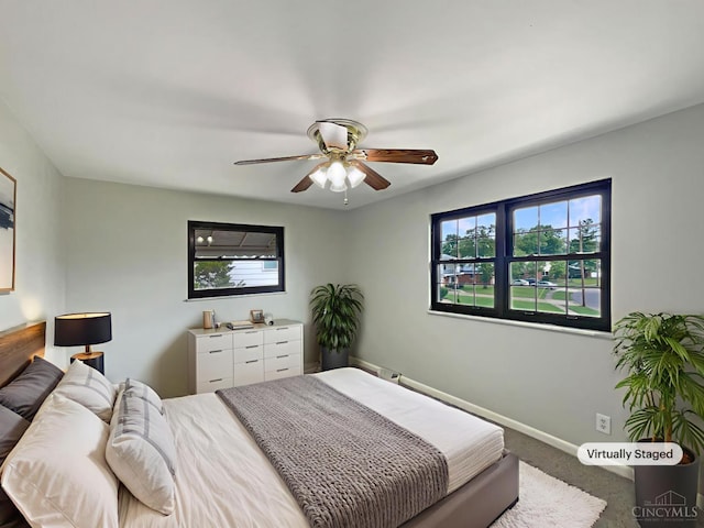 3198 Sunnyhollow Ln, Green Twp, OH 45239 - bedroom with multiple windows, carpet flooring, and ceiling fan