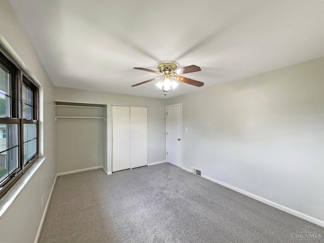 3198 Sunnyhollow Ln, Green Twp, OH 45239 - unfurnished bedroom featuring multiple closets, carpet flooring, and a ceiling fan