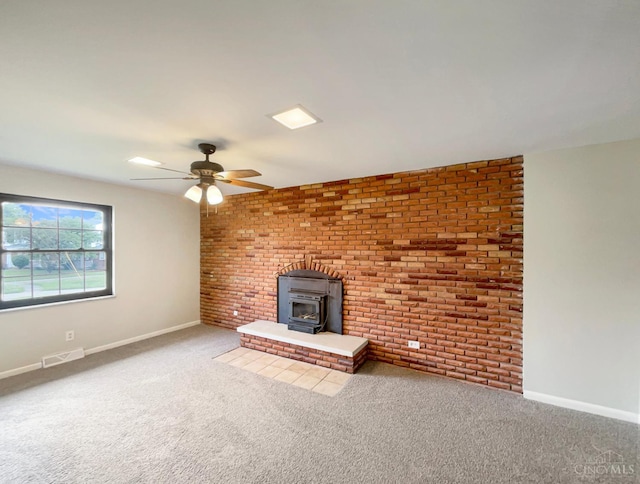 3198 Sunnyhollow Ln, Green Twp, OH 45239 - unfurnished living room featuring a wood stove, carpet flooring, and a ceiling fan