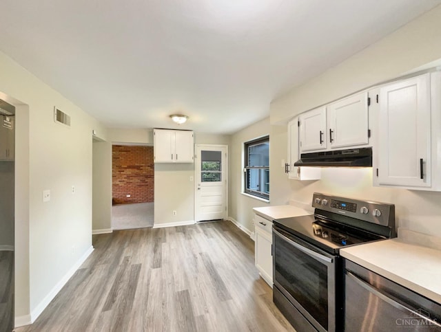 3198 Sunnyhollow Ln, Green Twp, OH 45239 - kitchen with appliances with stainless steel finishes, under cabinet range hood, white cabinetry, light wood finished floors, and light countertops