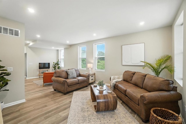 1582 Dixmont Ave, Cincinnati, OH 45207 - living room with light wood-type flooring and recessed lighting