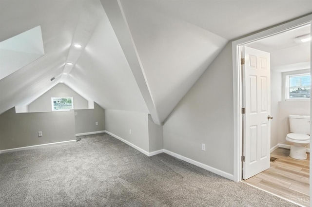 1582 Dixmont Ave, Cincinnati, OH 45207 - additional living space with lofted ceiling, healthy amount of natural light, and carpet flooring