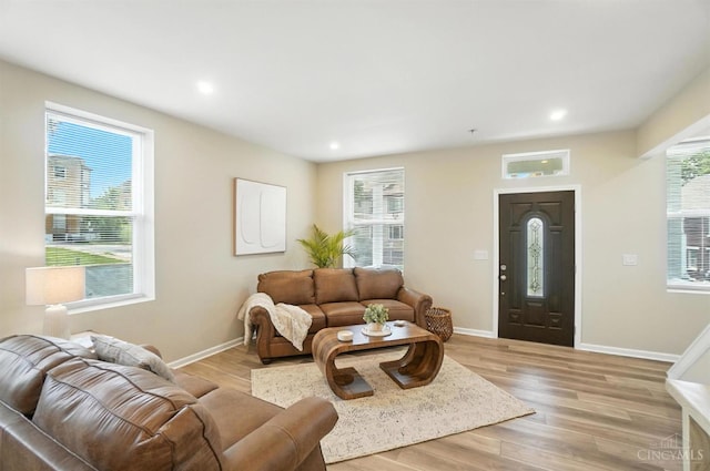 1582 Dixmont Ave, Cincinnati, OH 45207 - living area featuring plenty of natural light, light wood finished floors, and recessed lighting