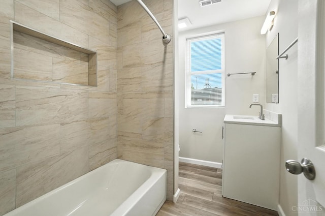 1582 Dixmont Ave, Cincinnati, OH 45207 - bathroom with vanity, wood finished floors, and shower / tub combination