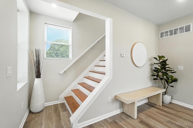 1582 Dixmont Ave, Cincinnati, OH 45207 - staircase with wood finished floors and recessed lighting