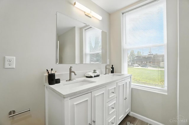 1582 Dixmont Ave, Cincinnati, OH 45207 - bathroom with double vanity and wood finished floors