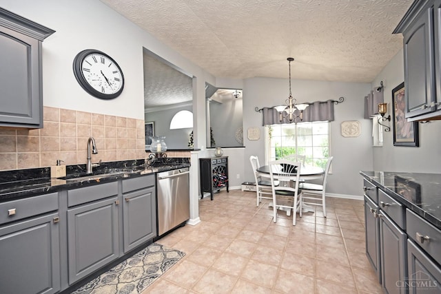 4154 Fieldsedge Dr, Mason, OH 45040 - kitchen with stainless steel dishwasher, a chandelier, a textured ceiling, decorative backsplash, and lofted ceiling